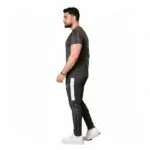 Front and back view of a man wearing the VALE brand breathable cotton performance tracksuit, featuring a vertical outline logo on the t-shirt back and matching side-striped joggers on a white background.