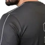 Front and back view of a man wearing the VALE brand breathable cotton performance tracksuit, featuring a vertical outline logo on the t-shirt back and matching side-striped joggers on a white background.