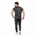Front and back view of a man wearing the VALE brand breathable cotton performance tracksuit, featuring a vertical outline logo on the t-shirt back and matching side-striped joggers on a white background.